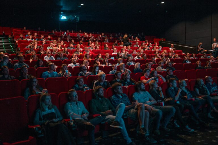 Audience seated in a cinema auditorium before a screening